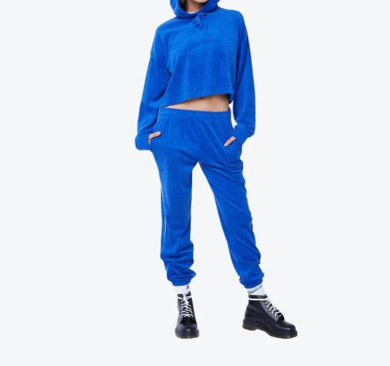 Tapered tight trousers for women with ankle-length fit and minimalist style -Surf The Web Micro Terry East Jogger Pant In Blue